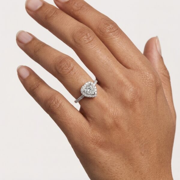 heart shaped diamond in the centre with brilliant cut diamonds claw set in the halo