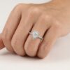 Pear shape diamond ( IGI Certified ) claw set in centre with brilliant cut diamonds claw set in halo and down band.