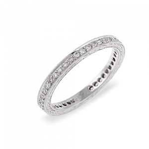 18ct White gold 44 round brilliant cut diamonds grain set completed around the band with mill grain edge and engraved pattern sides.