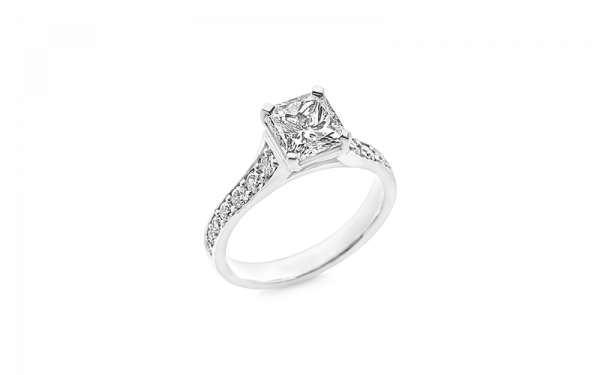 Radiant cut diamond ladies ring featuring round brilliant cut diamonds in 18ct white gold