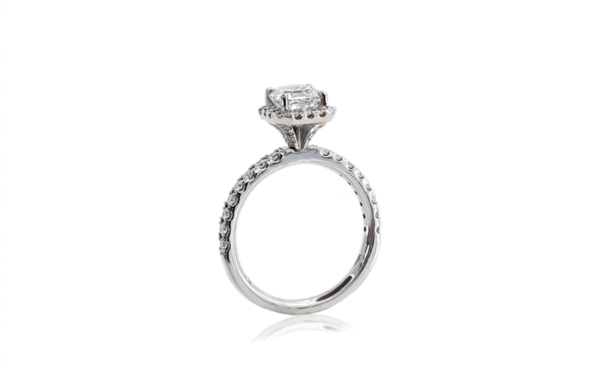 This halo style ring - Delora - features an Asscher cut diamond claw set in centre surrounded by brilliant cut diamonds in the halo and down the band.