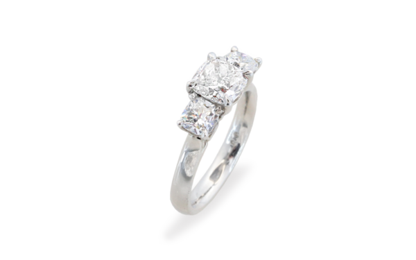 Cushion cut trilogy ring diamond set engagement ring