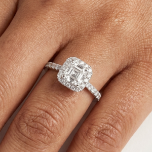 Asscher cut diamond halo ring on hand
